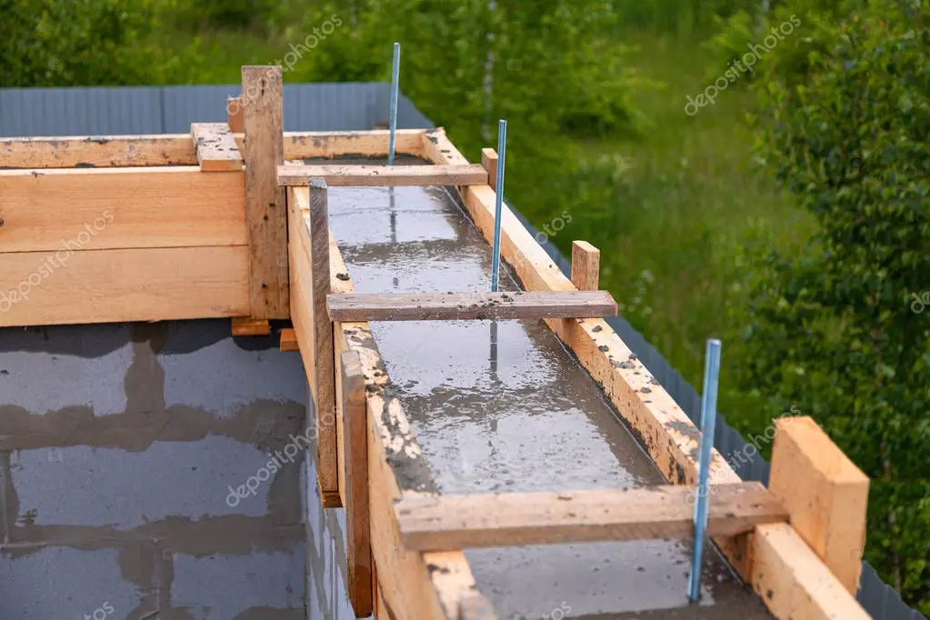 Concrete foundation being poured for a building