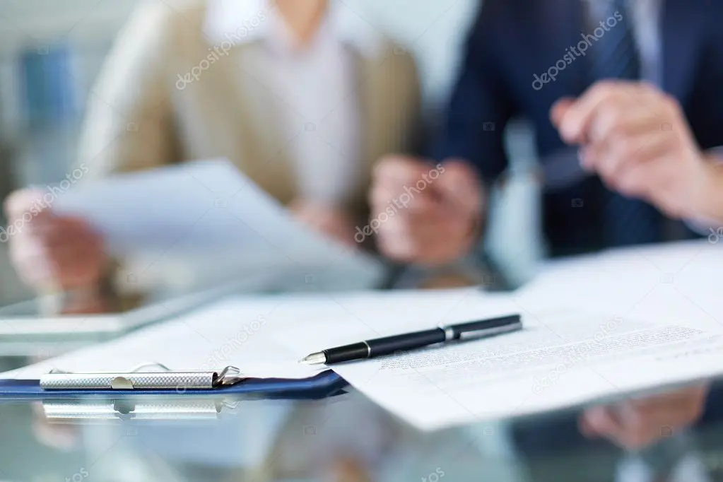 Contractor reviewing project documents with a client